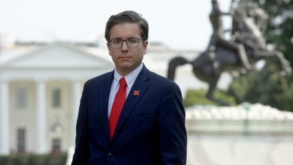 Santiago Diaz de Leon Dominguez in a red tie in front of the White House