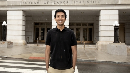 Tejas Sinha in from of building in DC