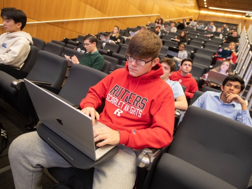 Rutgers student using a laptop during class