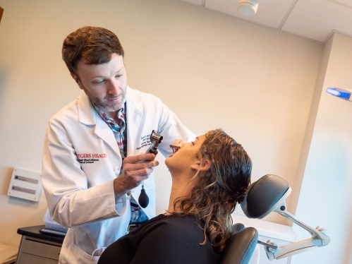 Rutgers Health doctor treating a patient